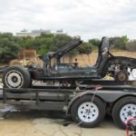 track car on trailer being cleaned